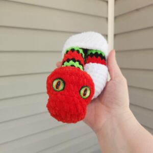 Red Baby Snake Hatching with Green Stripes